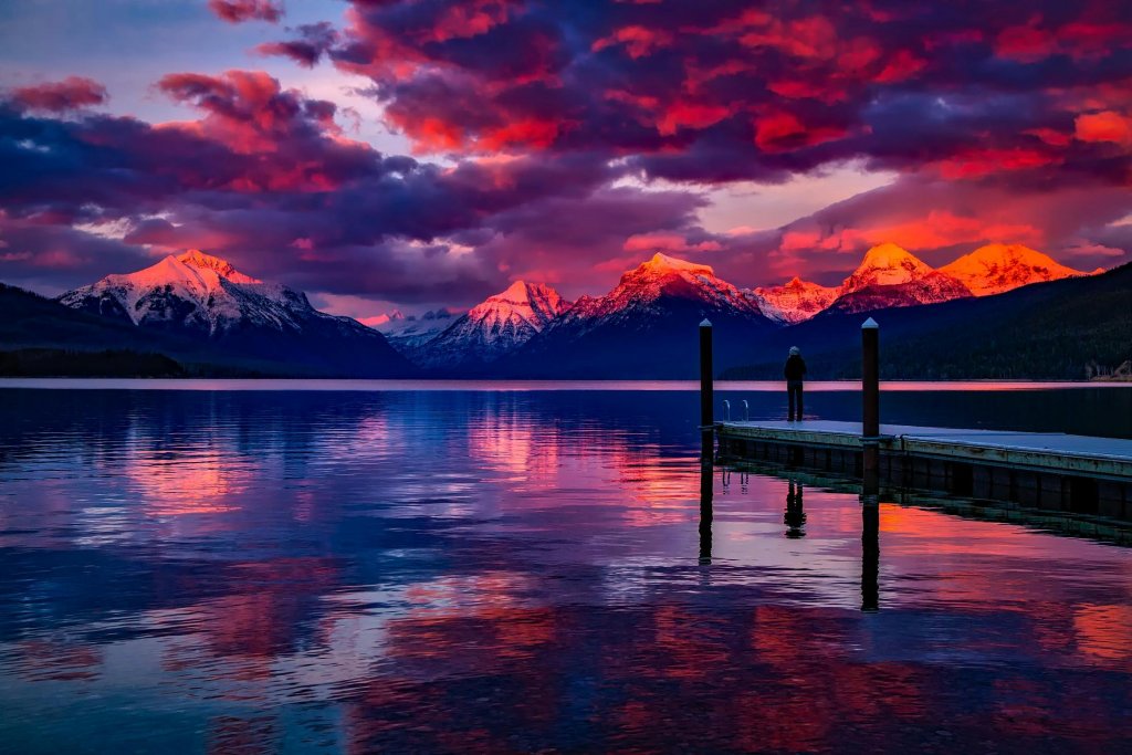 Dock Under Cloudy Sky in Front of Mountain