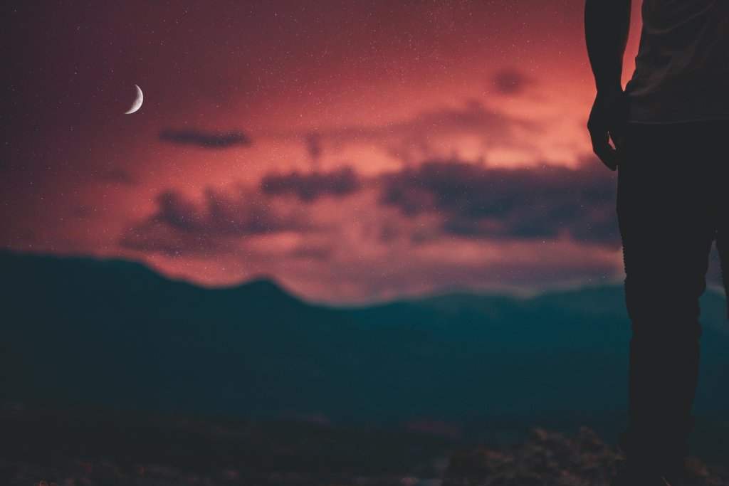 Person Standing on Cliff