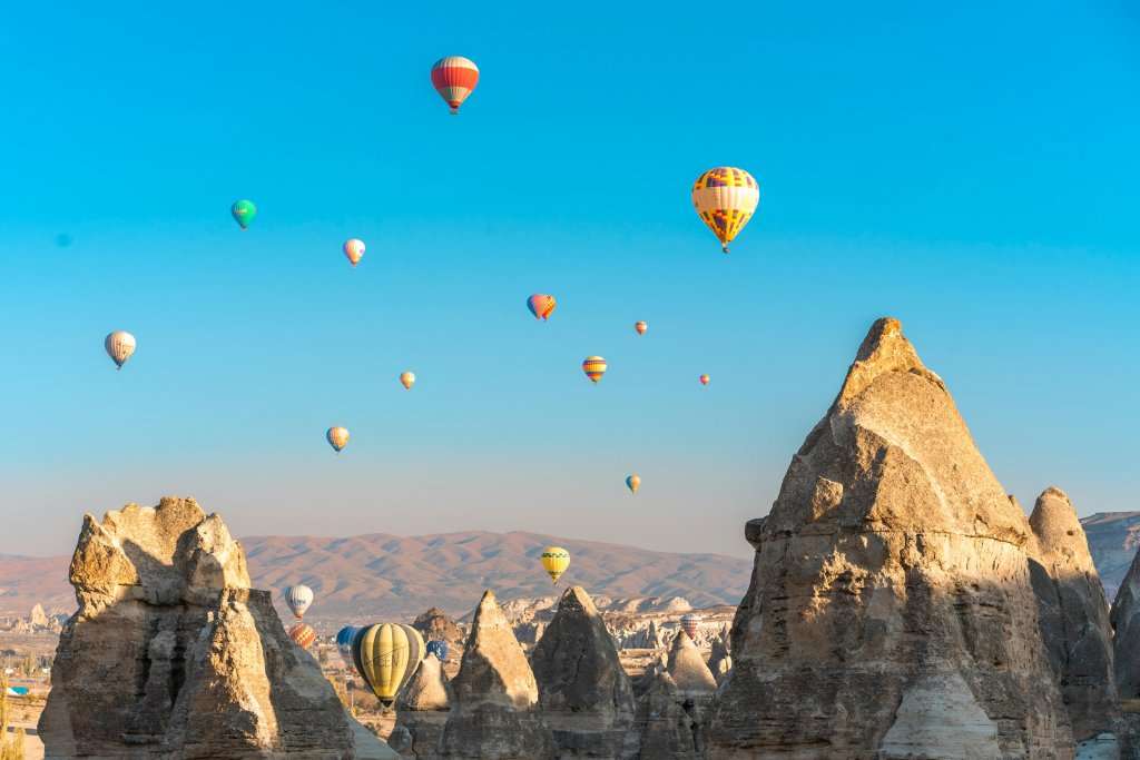 Hot Air Balloons above Mountains and Desert